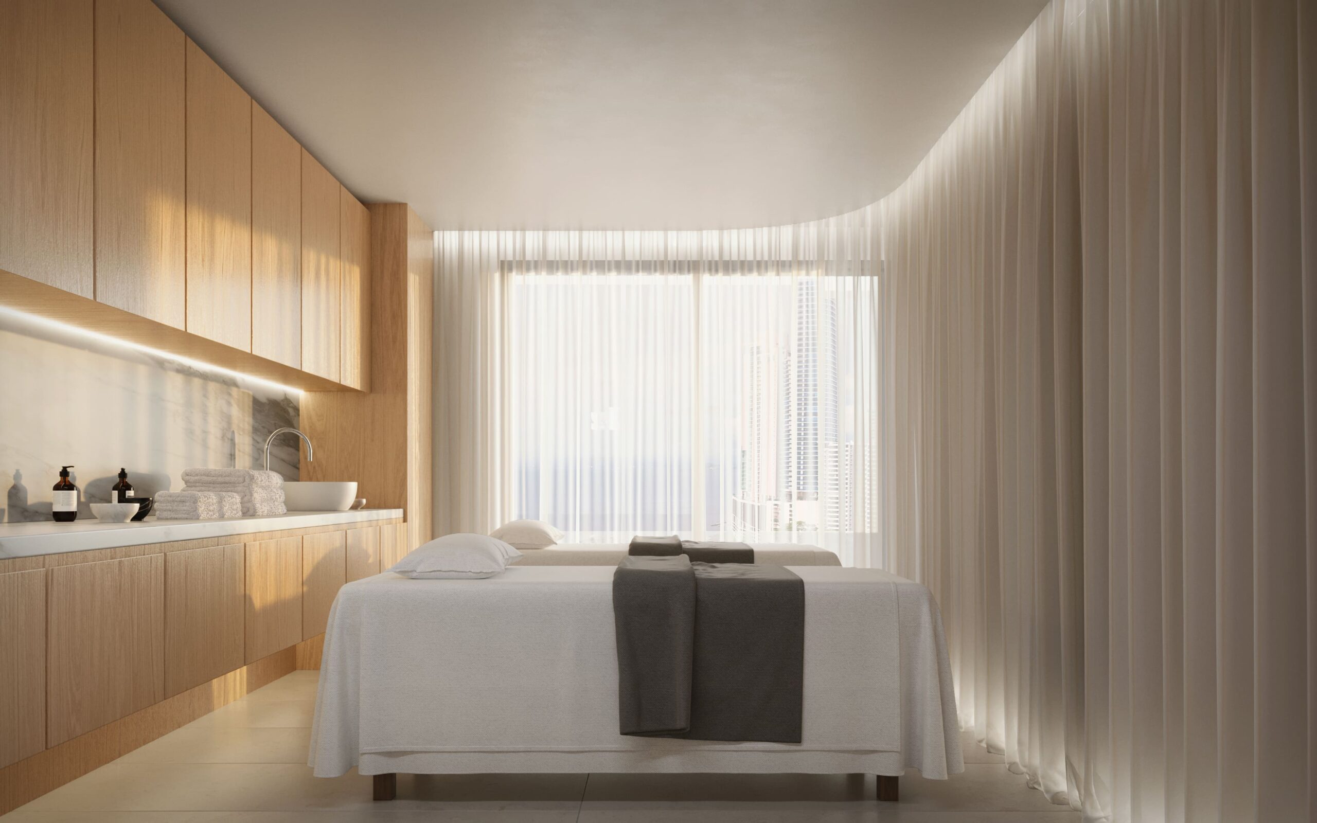 Spa treatment room with massage bed, warm lighting, and relaxing wellness-inspired interior